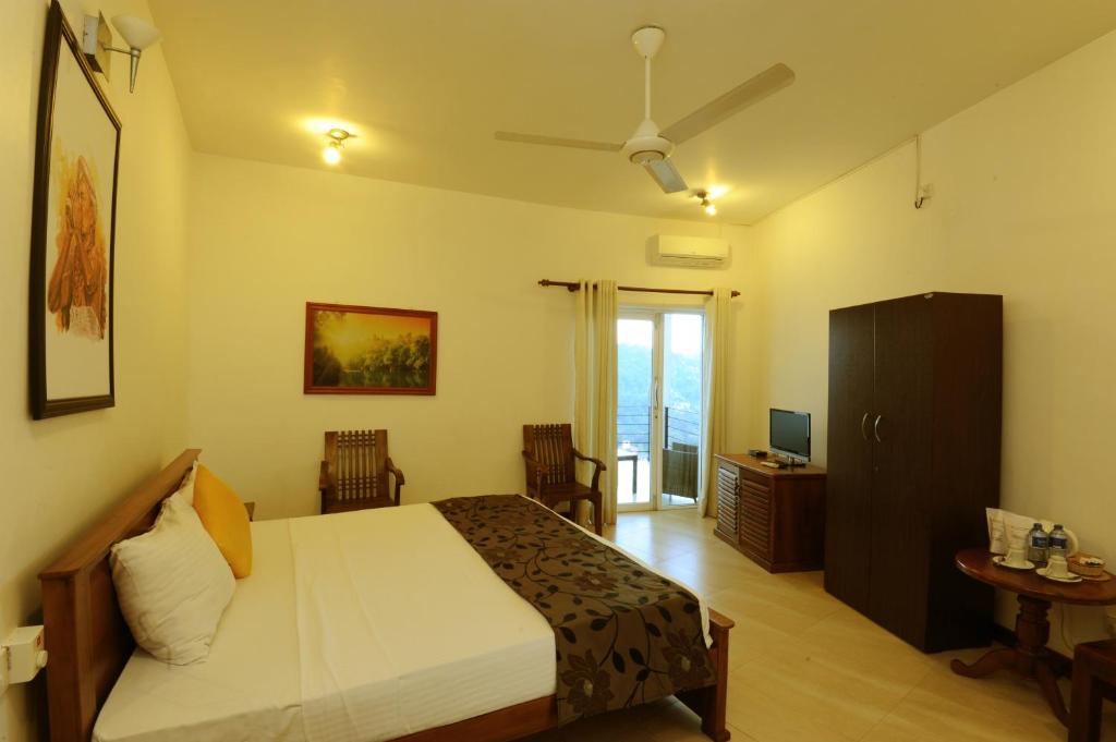Letto o letti in una camera di Hotel See Kandy