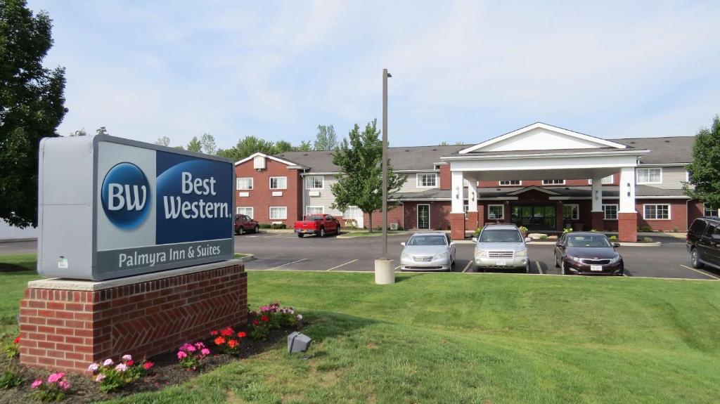 a best western sign in front of a parking lot at Best Western Palmyra Inn & Suites in Palmyra
