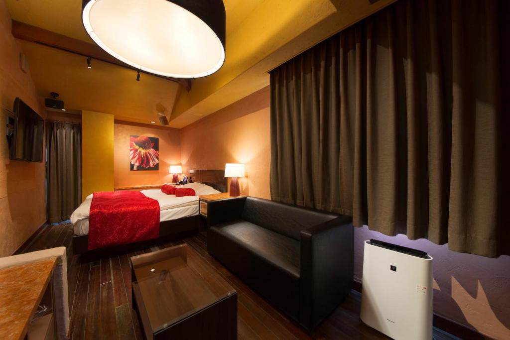 Postel nebo postele na pokoji v ubytování Hotel Lotus Nara (Adult Only)