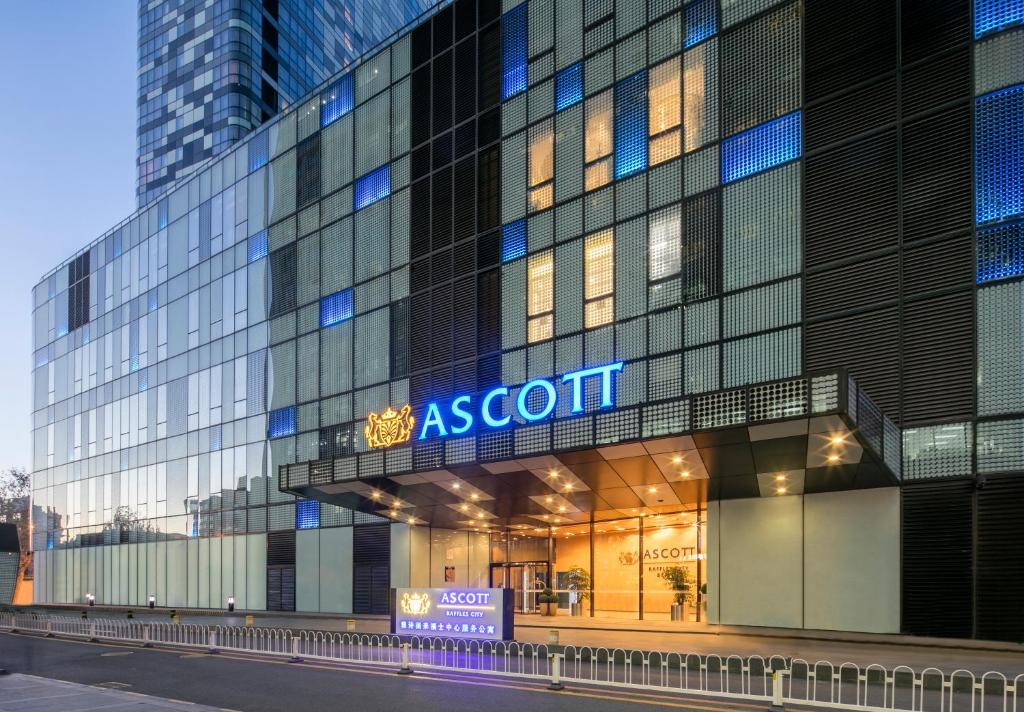 a building with a sign on the front of it at Ascott Raffles City Beijing in Beijing