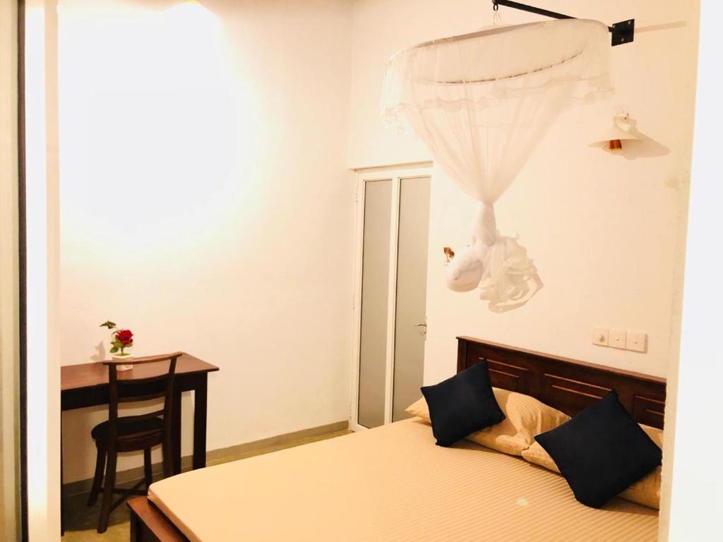 Postel nebo postele na pokoji v ubytování Holiday Inn Unawatuna