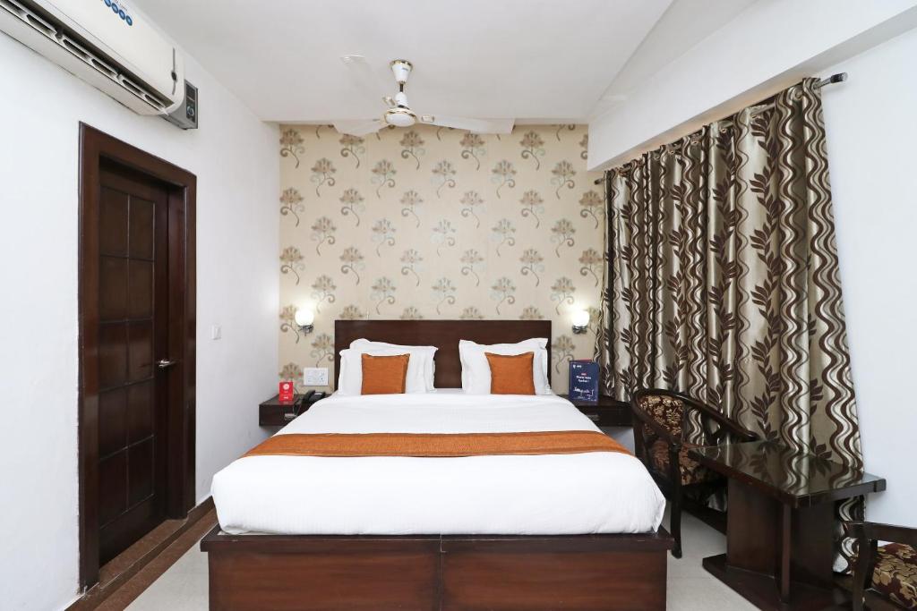 Postel nebo postele na pokoji v ubytování Hotel Samovar by Goyal Hotel