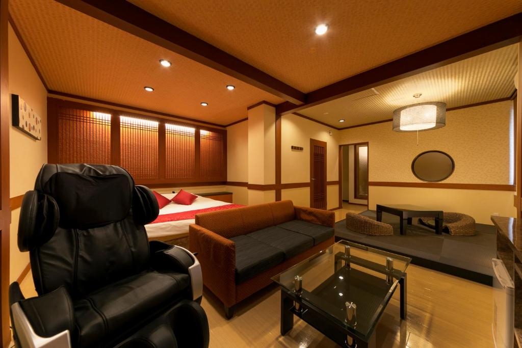 Postel nebo postele na pokoji v ubytování Hotel Lotus Sakai (Adult Only)