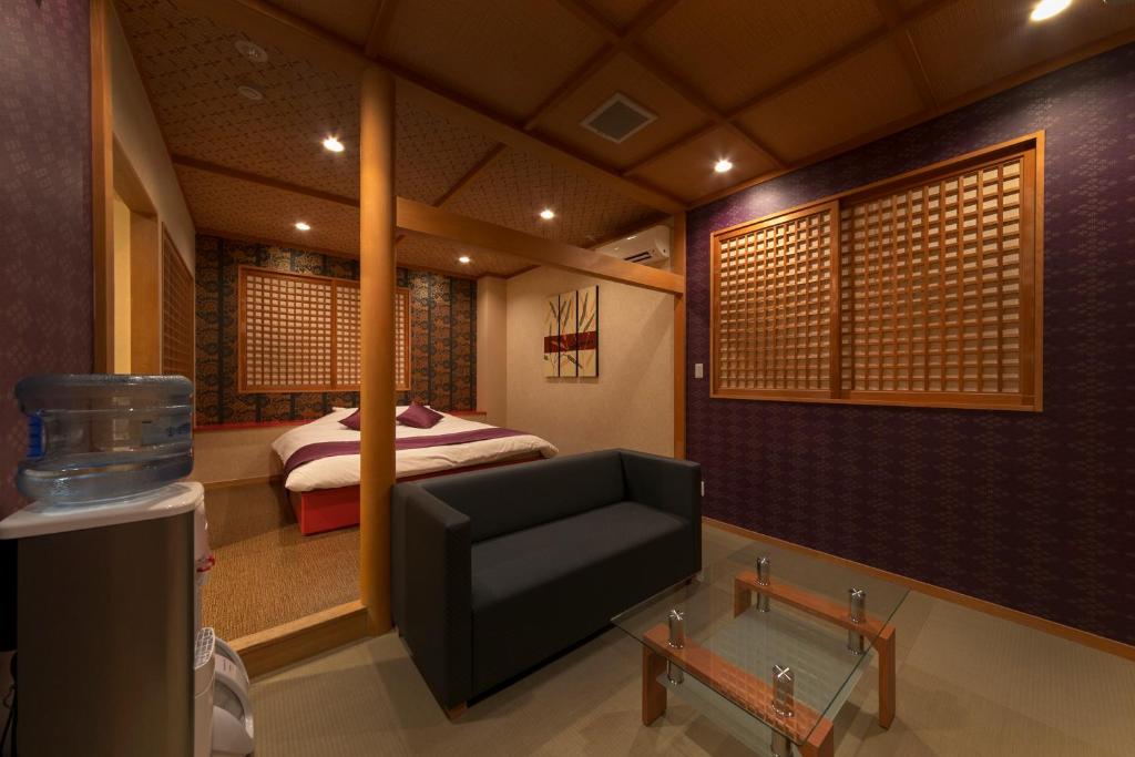 Postel nebo postele na pokoji v ubytování Hotel Lotus Sakai (Adult Only)