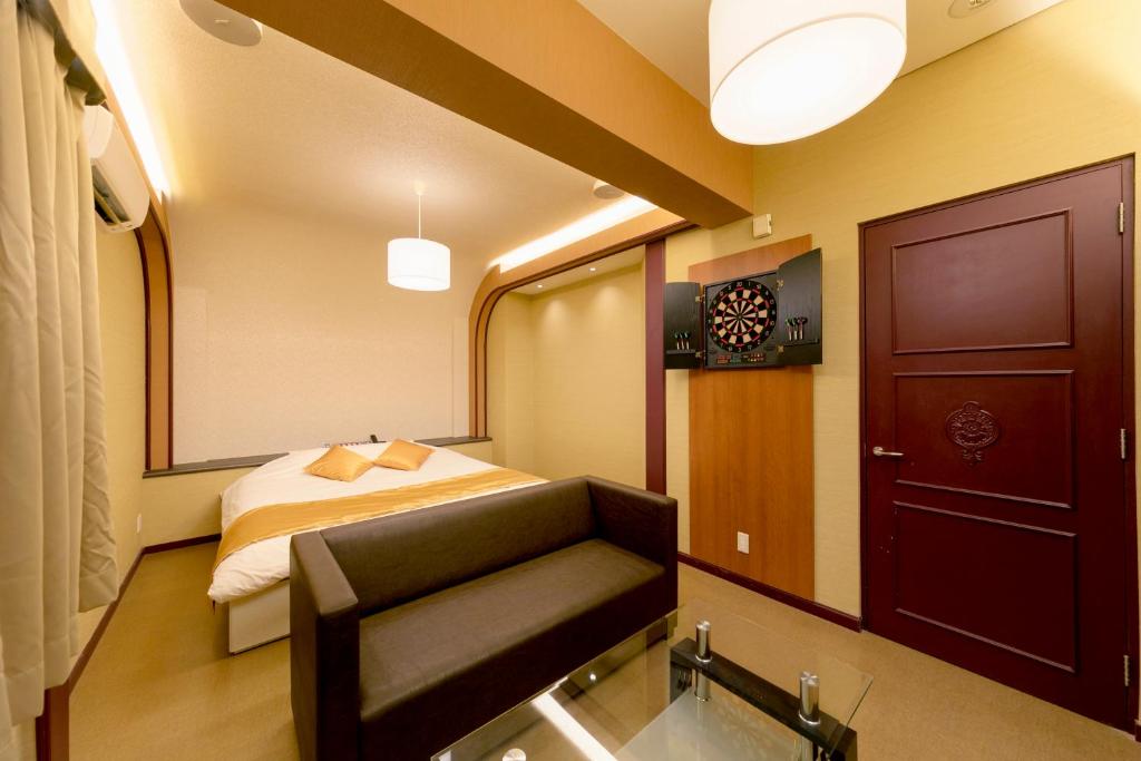 Postel nebo postele na pokoji v ubytování Hotel Lotus Sakai (Adult Only)