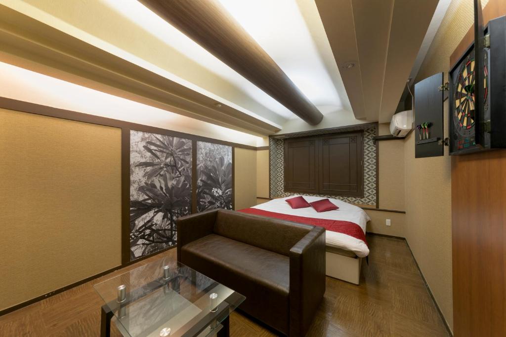 Postel nebo postele na pokoji v ubytování Hotel Lotus Sakai (Adult Only)