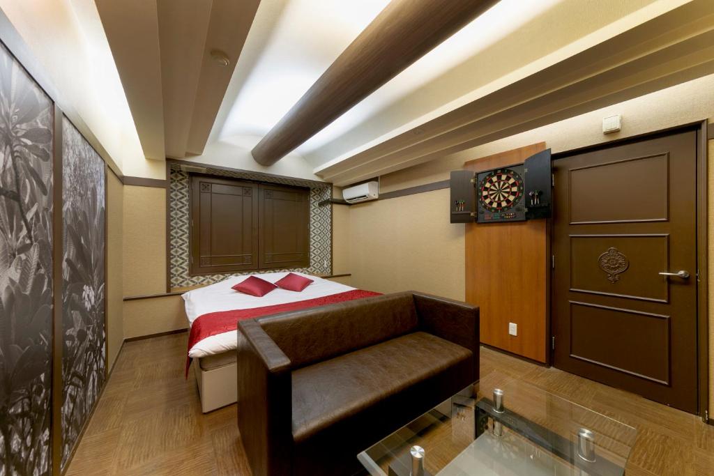 Postel nebo postele na pokoji v ubytování Hotel Lotus Sakai (Adult Only)