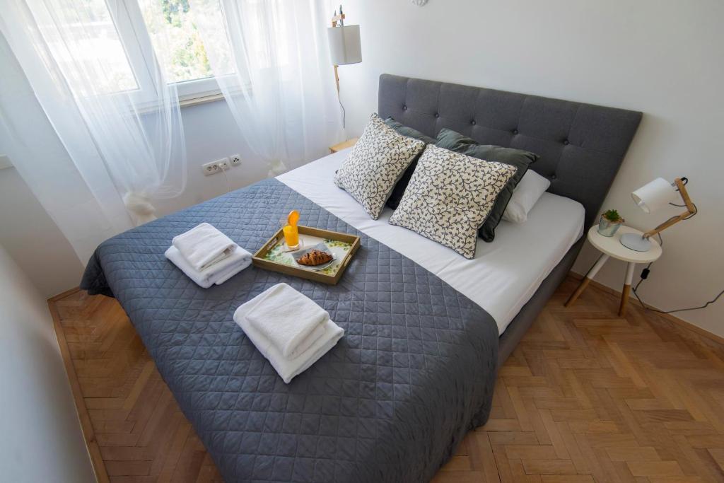Posteľ alebo postele v izbe v ubytovaní Apartment Lita Center