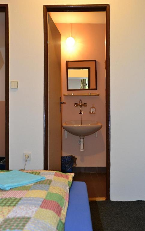 Postel nebo postele na pokoji v ubytování Penzion U Lípy