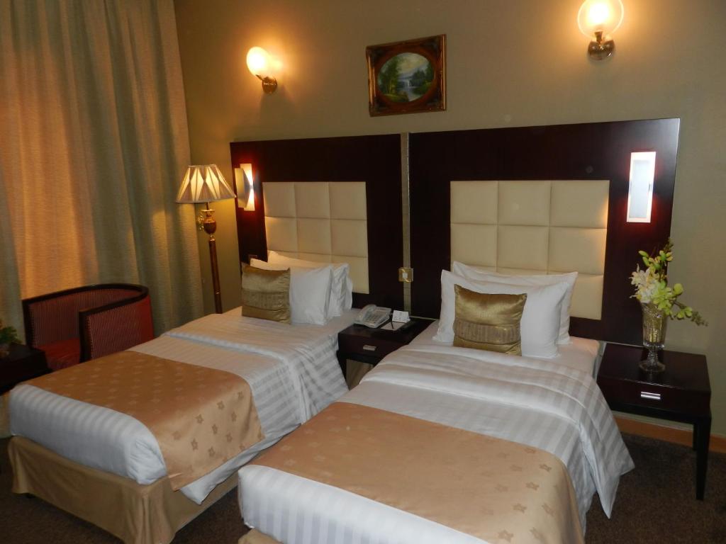 Postel nebo postele na pokoji v ubytování Sun & Sands Sea View Hotel