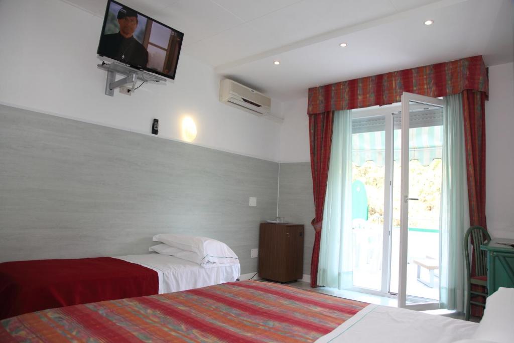 Postel nebo postele na pokoji v ubytování Hotel Soraya