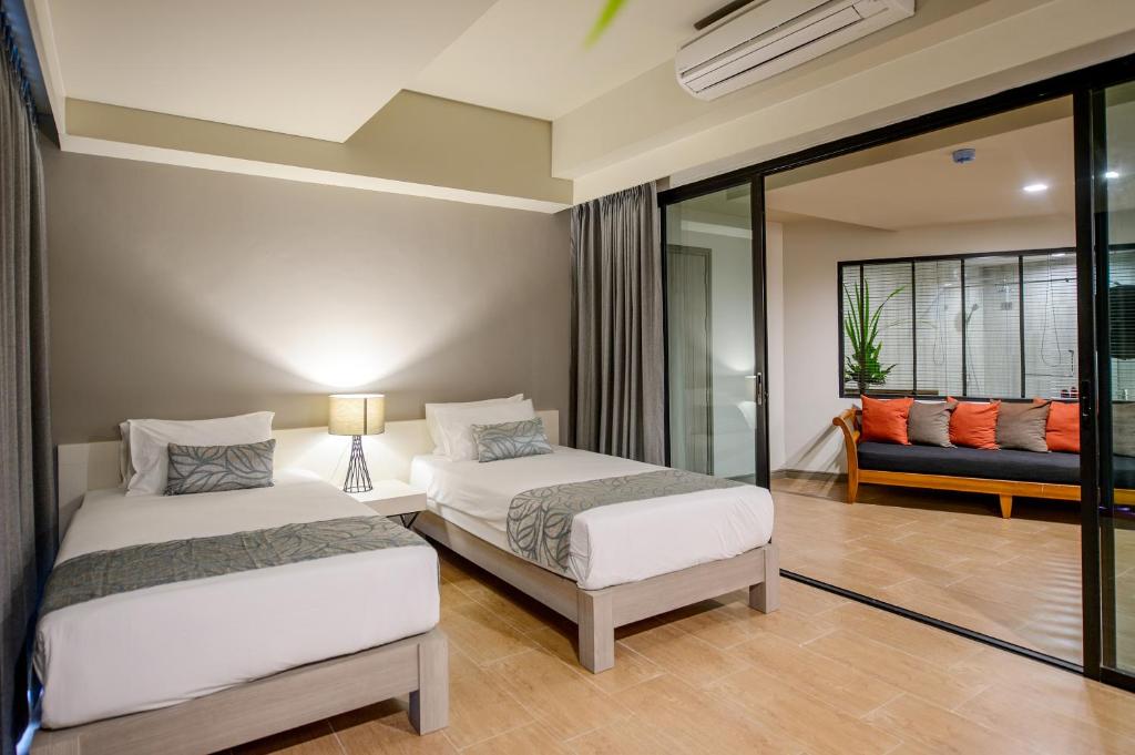 Кровать или кровати в номере Krabi La Playa Resort