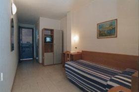 Postel nebo postele na pokoji v ubytování Piccolo Hotel