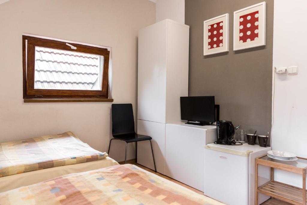 Postel nebo postele na pokoji v ubytování Apartmány Zadní mlýn