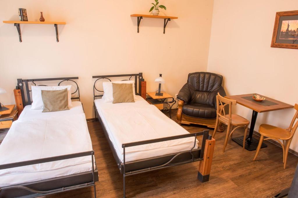 Postel nebo postele na pokoji v ubytování Residence Hattrick