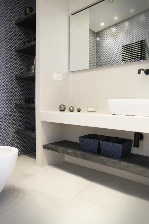 a bathroom with a sink and a mirror at MADA Charm Apartments Terrace&Carugio in Vernazza