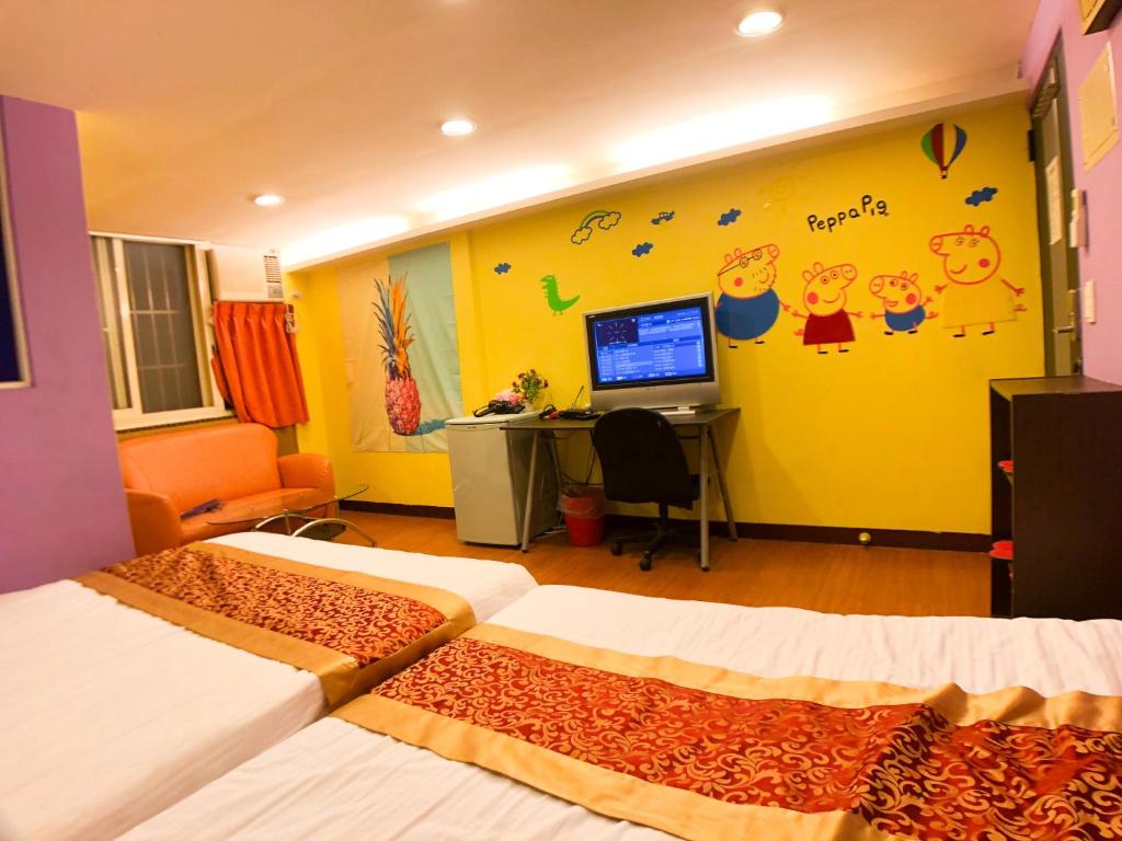 Postel nebo postele na pokoji v ubytování Fengchia Bichon B&B