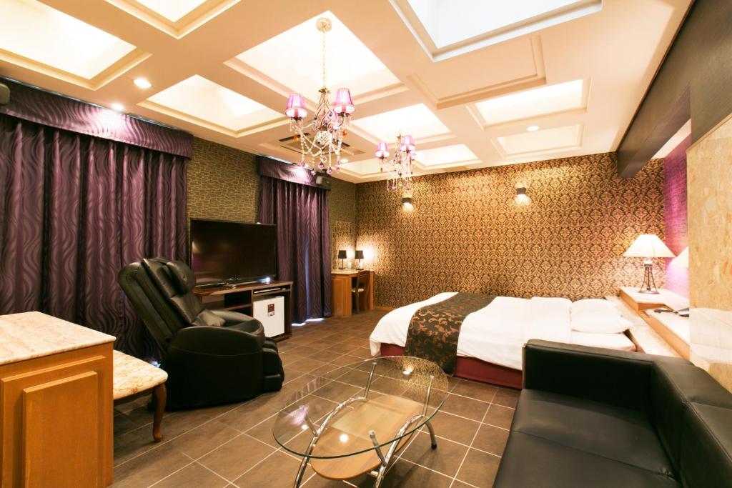 Postel nebo postele na pokoji v ubytování Hotel Atlantis Otsu (Adult Only)