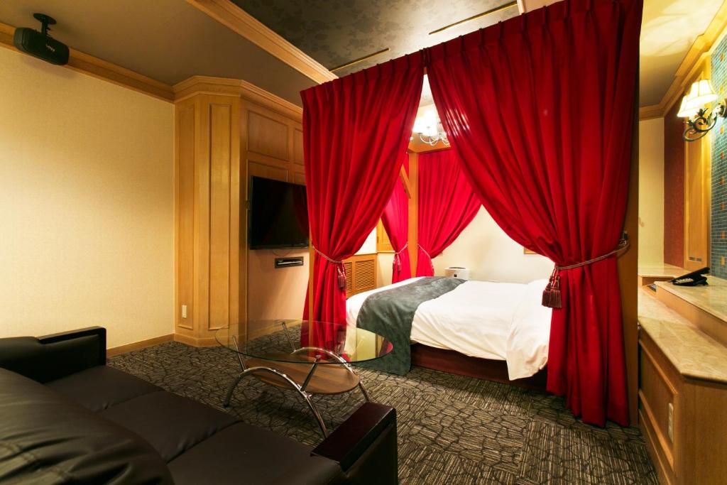 Postel nebo postele na pokoji v ubytování Hotel Atlantis Otsu (Adult Only)