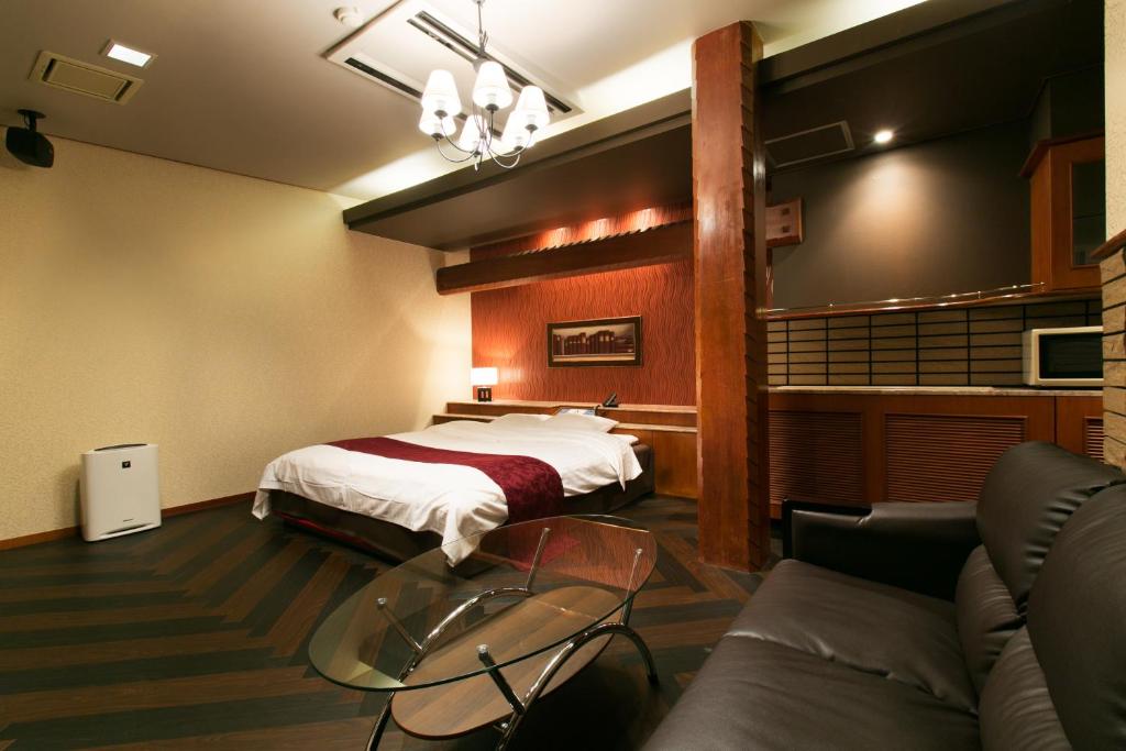 Postel nebo postele na pokoji v ubytování Hotel Atlantis Otsu (Adult Only)