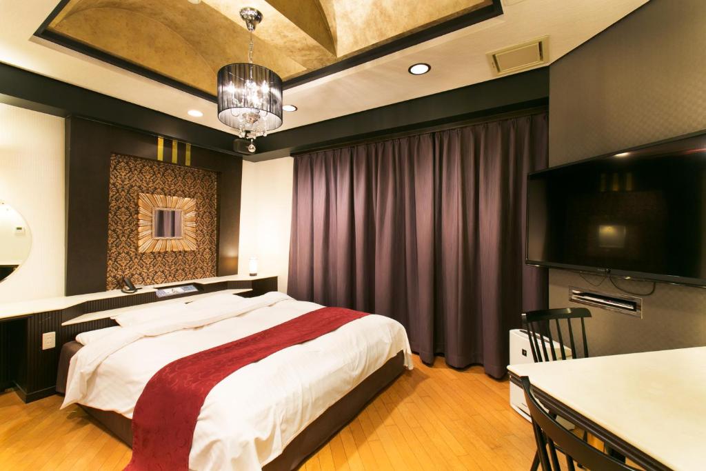 Postel nebo postele na pokoji v ubytování Hotel Atlantis Otsu (Adult Only)
