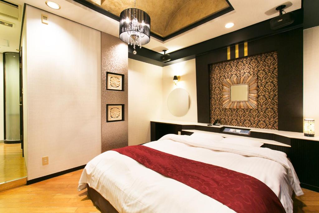 Postel nebo postele na pokoji v ubytování Hotel Atlantis Otsu (Adult Only)