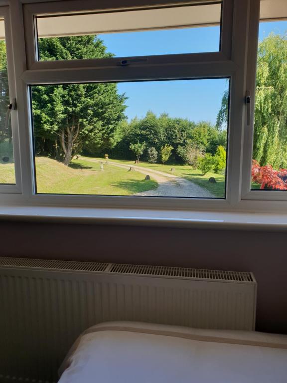Postel nebo postele na pokoji v ubytování Goshens Farm B&B
