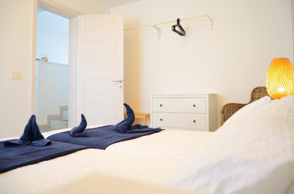 a bedroom with a bed with bat skulls on it at Apartamentos El Marinero - Avenida in Caleta de Sebo