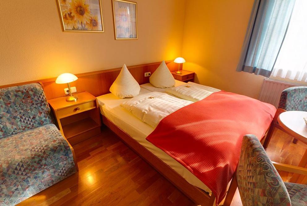 Postel nebo postele na pokoji v ubytování Hotel Tilman