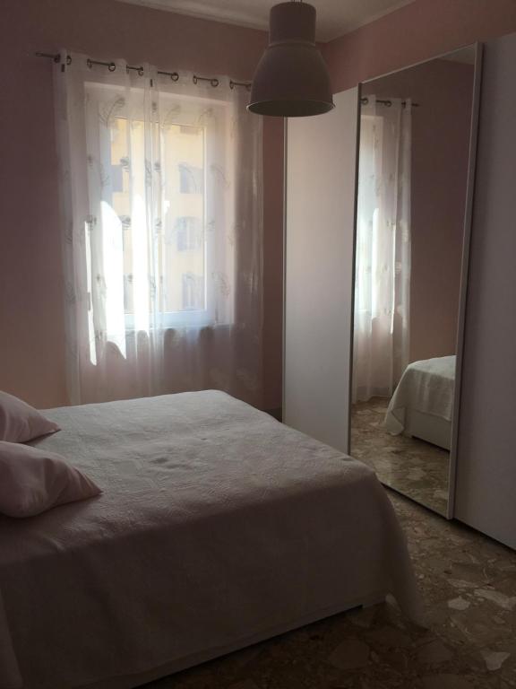 Łóżko lub łóżka w pokoju w obiekcie Appartamento - Casa vacanza Nonna Grazia