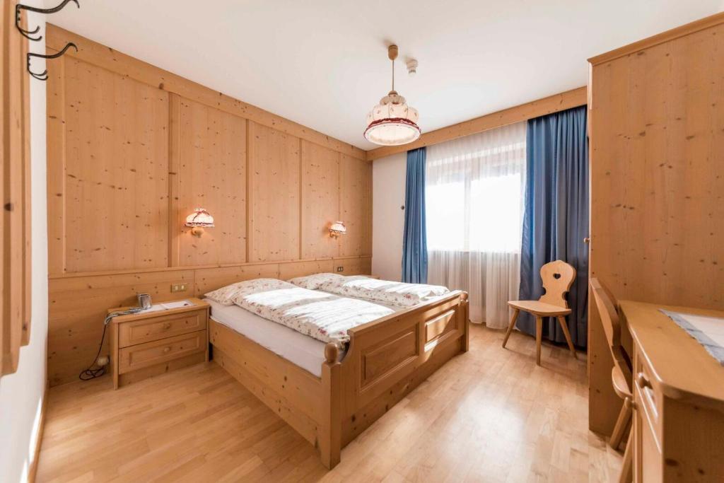 Postel nebo postele na pokoji v ubytování Garni Hotel Residence Diamant
