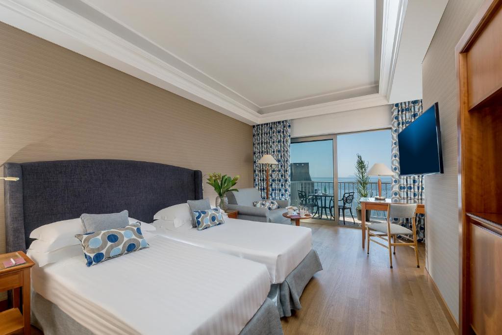 Postel nebo postele na pokoji v ubytování Hotel Royal Continental