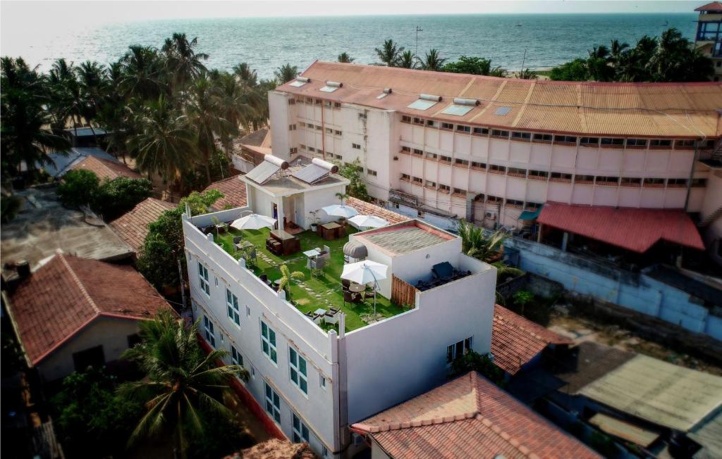 an aerial view of a building with plants on the roof at Blue Water Boutique Hotel in Negombo