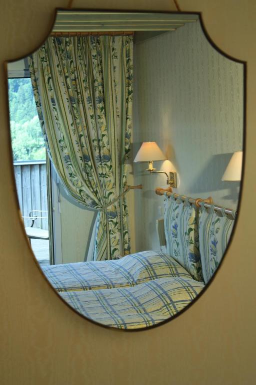 Postel nebo postele na pokoji v ubytování Hôtel Restaurant Taillard
