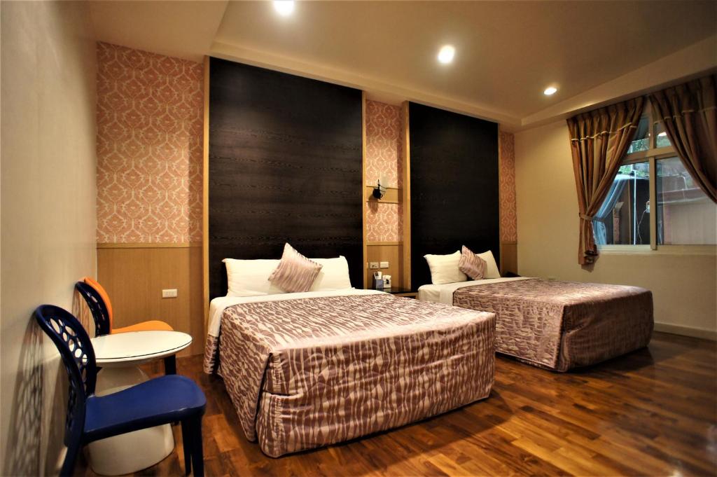 Postel nebo postele na pokoji v ubytování Xi Xin Guan Hot Spring Resort