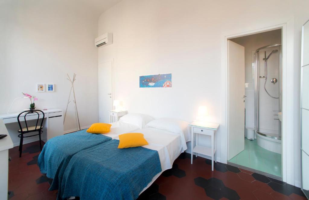 A bed or beds in a room at Florence Oasis