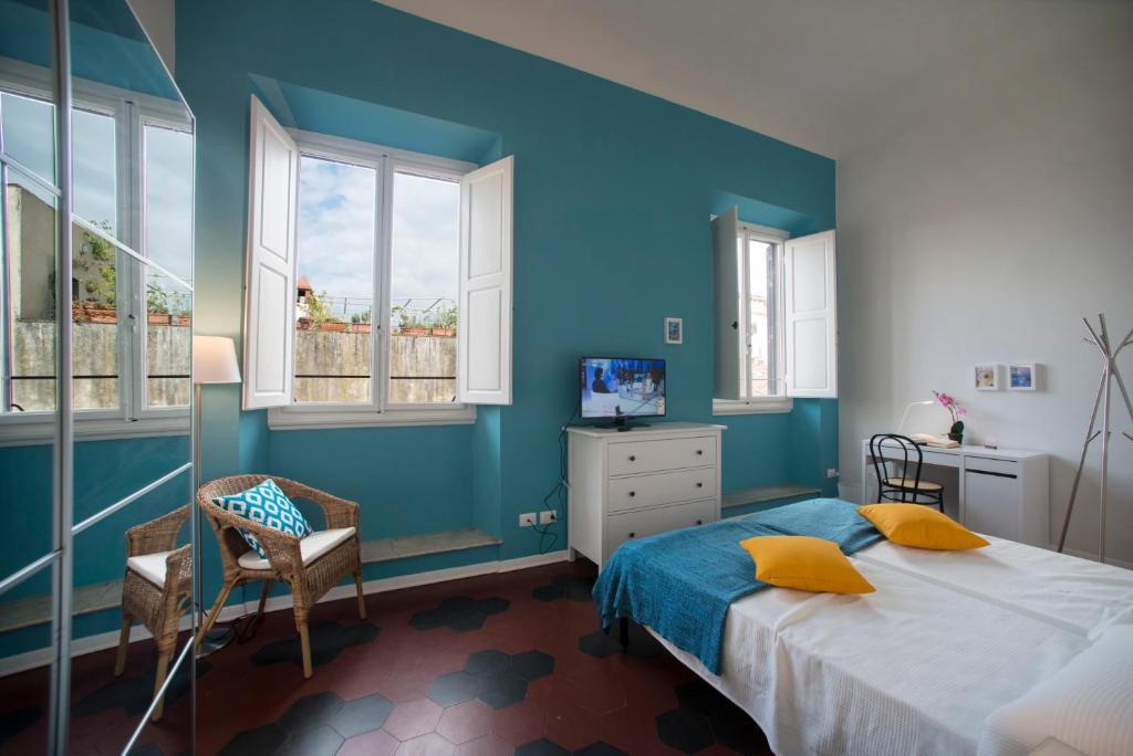 A bed or beds in a room at Florence Oasis
