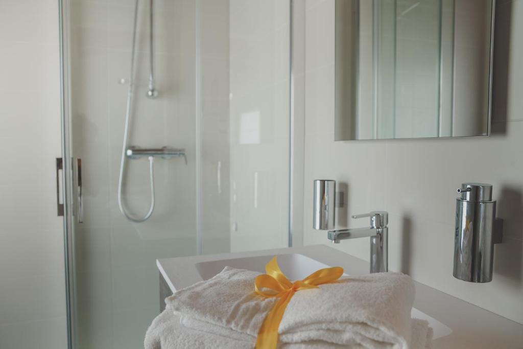 A bed or beds in a room at Terra Ferma Rooms&More