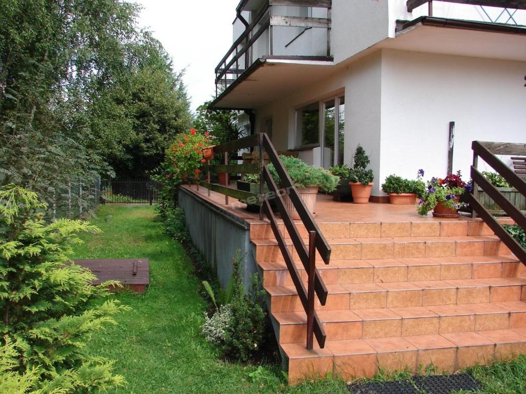 Vonkajšia záhrada v ubytovaní Pokoje Gościnne Pod Magnolią