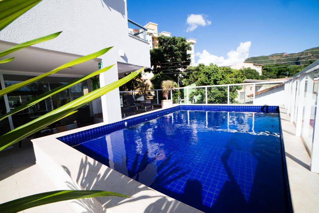 a swimming pool on the balcony of a house at Serra Madre Hotel in Rio Quente