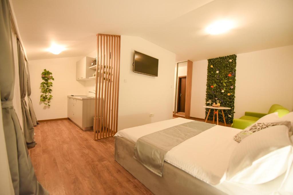 Postel nebo postele na pokoji v ubytování Korzo apartmani