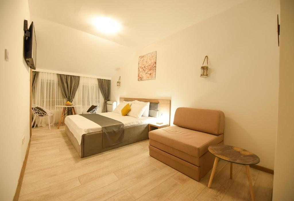 Postel nebo postele na pokoji v ubytování Korzo apartmani