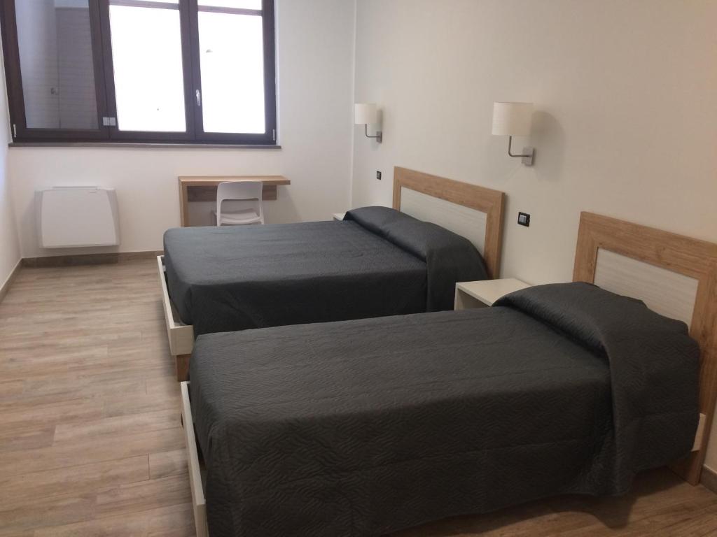Postel nebo postele na pokoji v ubytování B&B Le Cinque Cime