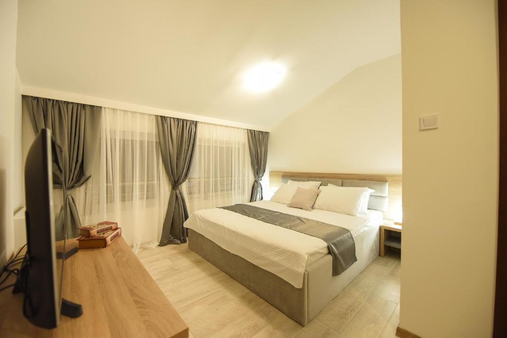 Postel nebo postele na pokoji v ubytování Korzo apartmani