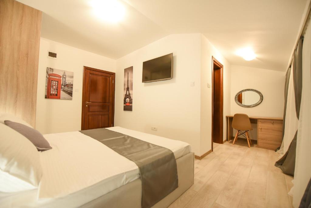 Postel nebo postele na pokoji v ubytování Korzo apartmani
