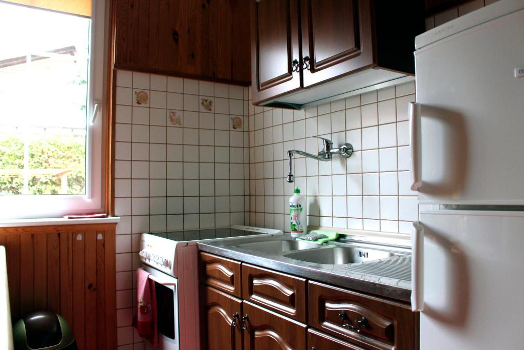 Kuchyň nebo kuchyňský kout v ubytování Rowianka