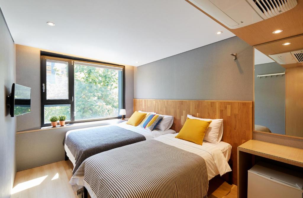 Cama ou camas em um quarto em Hostel CLEO Seoul Hongdae