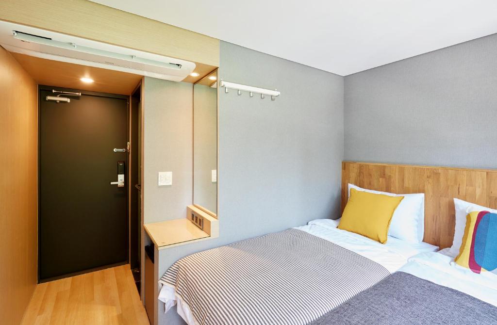 Cama ou camas em um quarto em Hostel CLEO Seoul Hongdae