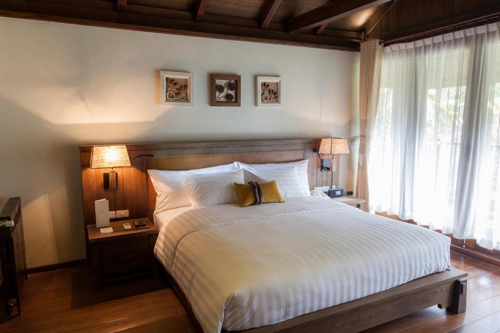 Postel nebo postele na pokoji v ubytování Melia Ba Vi Mountain Retreat