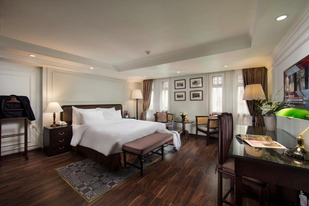 Postel nebo postele na pokoji v ubytování Hong Ngoc Dynastie Boutique Hotel & Spa